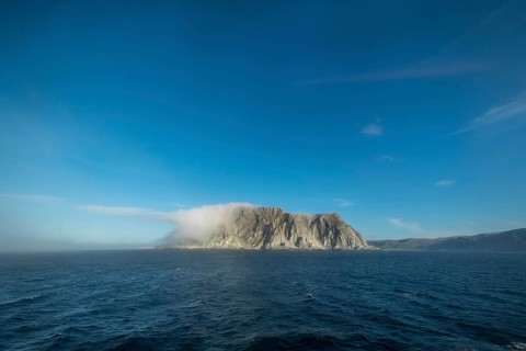 Island in the fog, Kjøllefjord, Finnmark, Norway, Scandinavia, Europe, adventure travel, tourism,