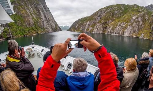 Cruise in a fjord, ship bow, photographing tourists, Digermulen, Nordland, Norway, Scandinavia,