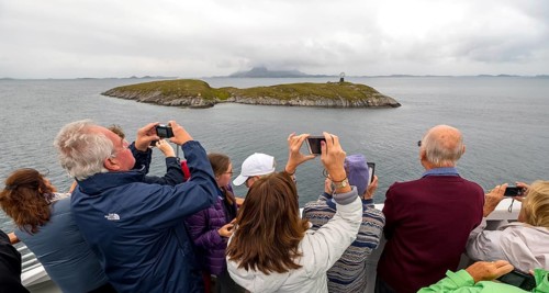 Arctic Circle Globe, Polar Circle Globe, Vikingen Island, photographing tourists, Tonnes, Nordland,