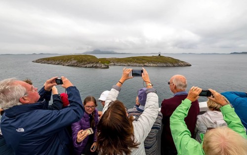 Arctic Circle Globe, Polar Circle Globe, Vikingen Island, photographing tourists, Tonnes, Nordland,