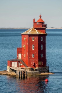 Kjeungskjær Fyr, red lighthouse, off the Norwegian coast on a small archipelago off Ã˜rland,
