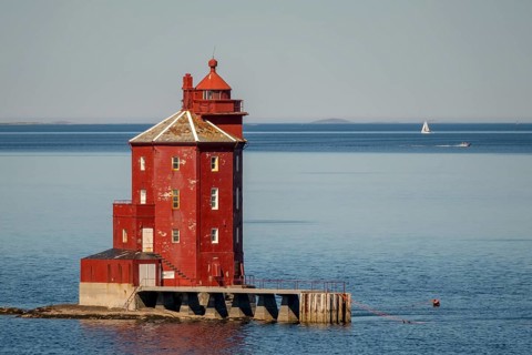 Kjeungskjær Fyr, red lighthouse, off the Norwegian coast on a small archipelago off Ã˜rland,
