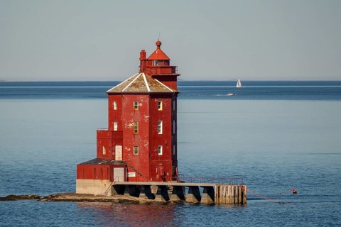 Kjeungskjær Fyr, red lighthouse, off the Norwegian coast on a small archipelago off Ã˜rland,