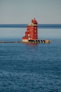 Kjeungskjær Fyr, red lighthouse, off the Norwegian coast on a small archipelago off Ã˜rland,