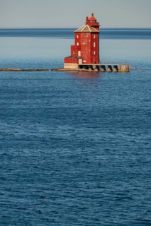 Kjeungskjær Fyr, red lighthouse, off the Norwegian coast on a small archipelago off Ã˜rland,