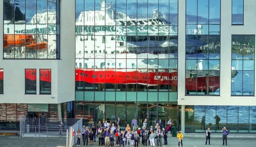 Cruise ship MS Polarlys, reflection, tourists at the quay, Ã...lesund, Møre og Romsdal, Norway,