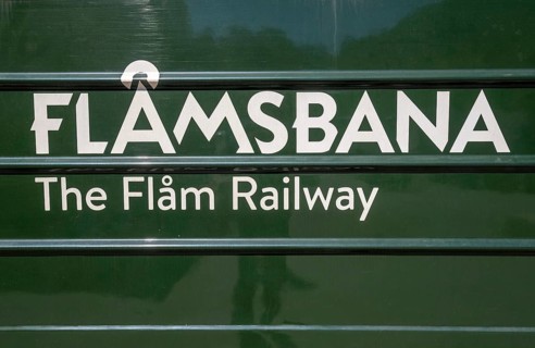 Journey on the Flam Railway, iron railway, green train with white lettering FlÃ¥msbana, The Flam