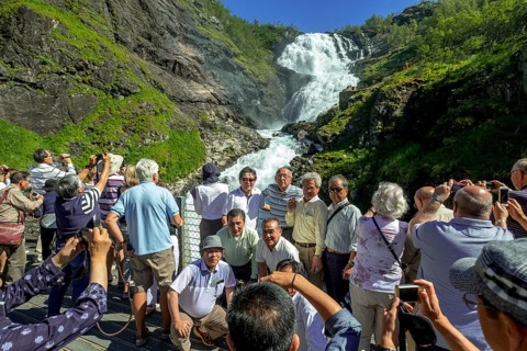 Kjosfossen waterfall, photographing tourists, waterfall near Fureberget, mountain, rock faces,