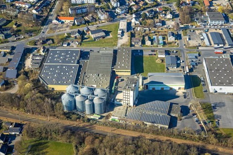 Aerial view, commercial area with Knauf Interfer Aluminium GmbH and Raiffeisen Vital eG