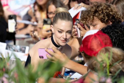 Venice, Italy - 1 September 2025: Amanda Seyfried signing autographs during the Red Carpet of - The