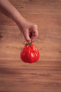 Khinkali tomatoes, on a wooden cutting board, wooden background, no people