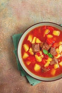 Meat goulash, with potatoes and carrots, sweet pepper, traditional Hungarian soup, homemade, no