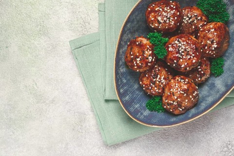 Tsukune, Japanese meatballs, minced chicken, fried on a skewer, with yakitori sauce, homemade, no