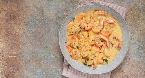 Shrimp in creamy garlic sauce, with spices and herbs