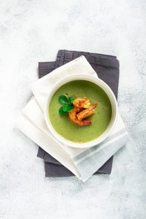 Pea cream soup, with shrimp, green soup, homemade, top view, no people