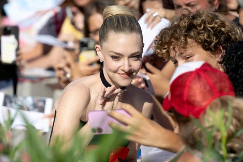 Venice, Italy - 1 September 2025: Amanda Seyfried signing autographs during the Red Carpet of - The