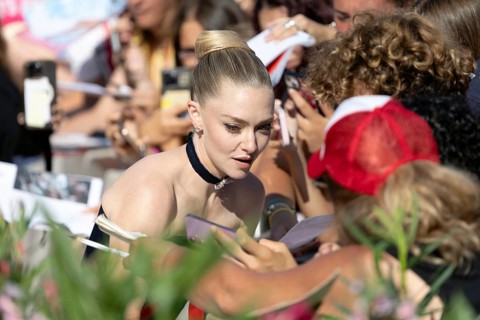 Venice, Italy - 1 September 2025: Amanda Seyfried signing autographs during the Red Carpet of - The