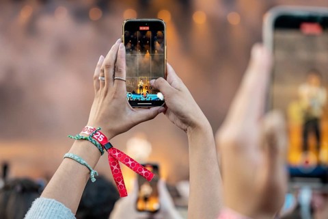 Visitors film the performance of Shawn Mendes at the Superbloom Festival, Day 2 at the Olympiapark,