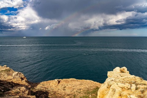 Rainbow over the Adriatic Sea near Polignano a Mare, Apulia, Italy