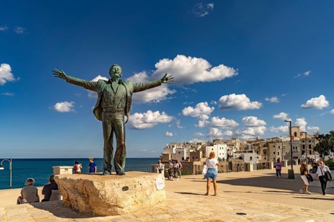 Statue of the singer Domenico Modugno, Polignano a Mare, Apulia, Italy