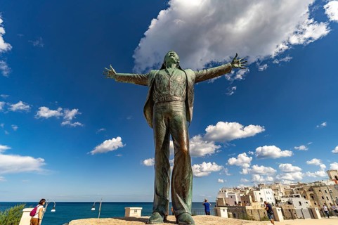 Statue of the singer Domenico Modugno, Polignano a Mare, Apulia, Italy