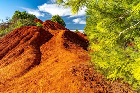Red rocks in the landscape at Cava di Bauxite, Otranto, Apulia, Italy