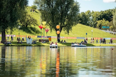 Festival visitors ride a pedal boat at the Superbloom Festival, Day 2 in the Olympic Park, Munich,