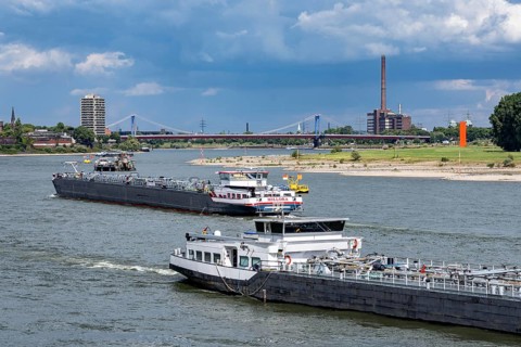Cargo ships on the Rhine near Duisburg, in the background the Friedrich-Ebert-Bridge between