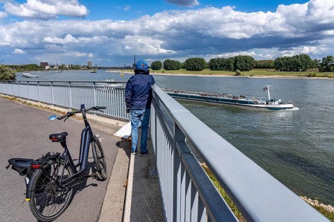 Cargo ships on the Rhine near Duisburg, in the background the Friedrich-Ebert-Bridge between