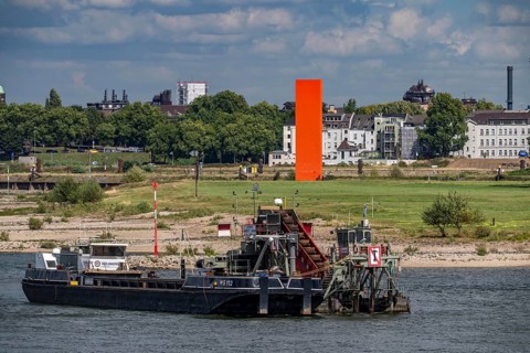 Bucket chain dredger at work on the Rhine near Duisburg, between the Neuenkamper Rhine Bridge and