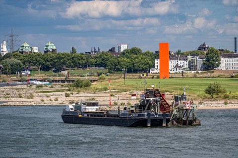 Bucket chain dredger at work on the Rhine near Duisburg, between the Neuenkamper Rhine Bridge and