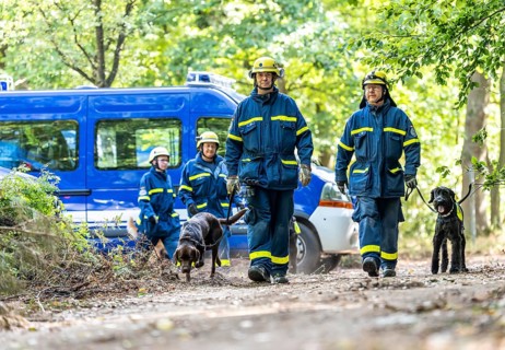 Dog handlers with rescue dogs from the Specialist Locating Group get ready for action, the sniffer