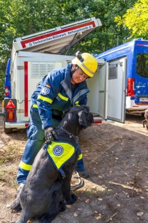 Dog handlers with rescue dogs from the Specialist Locating Group get ready for action, the sniffer