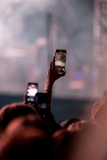 Visitors film Post Malone's performance at the Superbloom Festival, Day 1 at the Olympiapark,