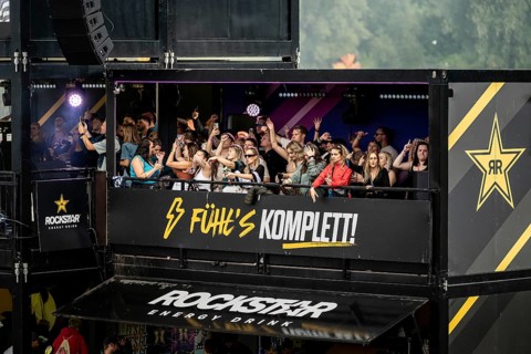 Festival visitors celebrate on the Rockstar Energy Tower at the Superbloom Festival, Day 1 in the
