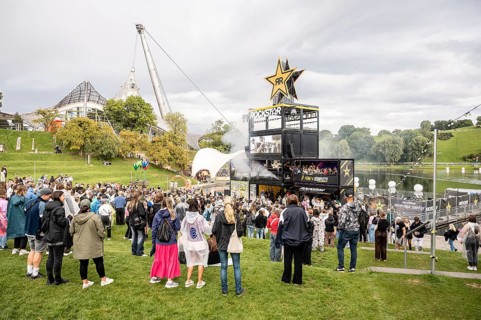 Festival visitors celebrate on the Rockstar Energy Tower at the Superbloom Festival, Day 1 in the