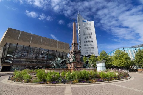 City skyscraper at Augustusplatz with Mende fountain, Leipzig, Saxony, Germany, 26.08.2025 <