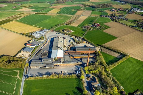 Aerial view, Raiffeisen Vital eG and Hüning Elementbau with chimney, Olfen-Kirchspiel, Olfen,