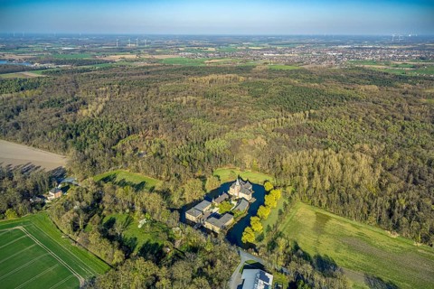 Aerial view, Schloss Sandfort, also Haus Sandfort, moated castle and moat, surrounded by a wooded