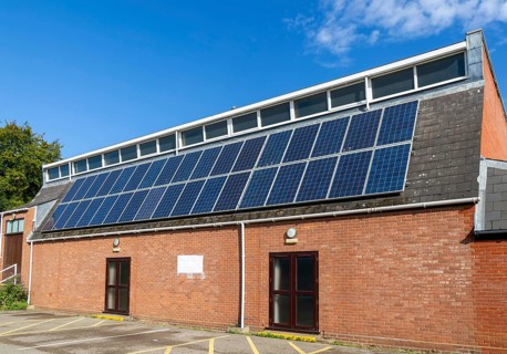 Solar panels on roof of Woodbridge Community Hall, community centre building, Woodbridge, Suffolk,