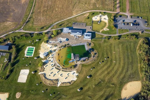 Aerial view, natural swimming pool Olfen outdoor pool and sandy beach and water playground,