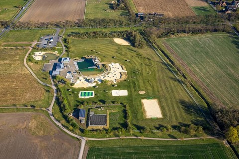 Aerial view, natural swimming pool Olfen outdoor pool and sandy beach and water playground,