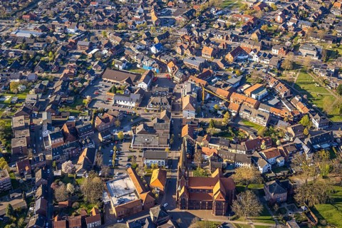 Aerial view, city centre view with town hall and new building site with facade cladding, market