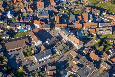 Aerial view, city centre view with town hall and new building site with facade cladding, market