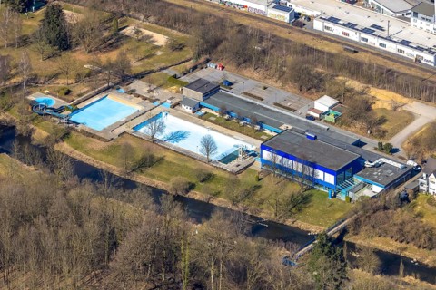 Aerial view, outdoor and indoor swimming pool, tree reflected in the pool, Meschede town, Meschede,