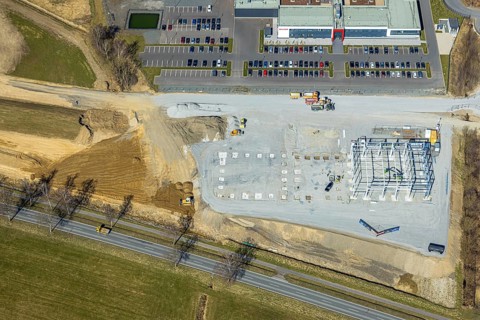 Aerial view, construction site with wire scaffolding next to Briloner Leuchten Werk, Enste,