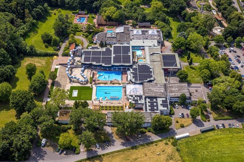 Aerial view, LAGO Die Therme, swimming pool and wellness centre with water slide, roof with solar