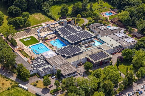 Aerial view, LAGO Die Therme, swimming pool and wellness centre with water slide, roof with solar
