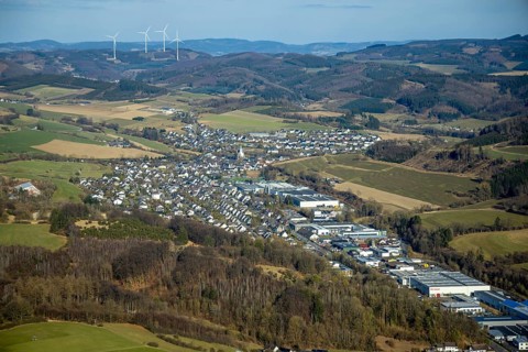 Aerial view, Elspe commercial area with residential area and village view with catholic church St.