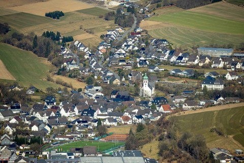 Aerial view, residential area and village view with catholic church St. Jakobus der Ältere in